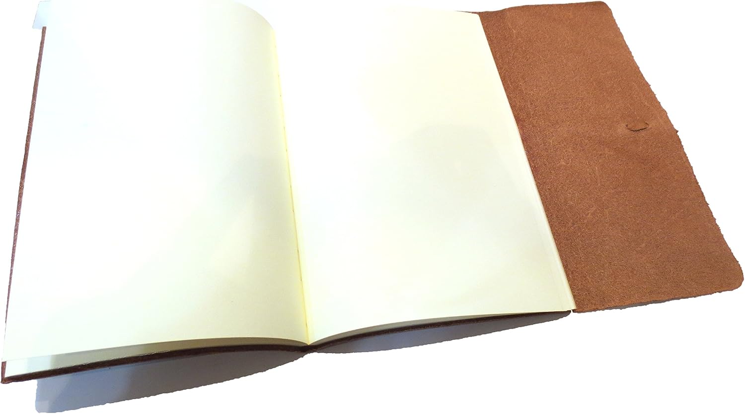 A brown textured leather journal with a matching elastic band closure and a round white paper label that reads: journalino' 
ITALIAN JOURNAL,
 made in Italy for 
Cavallini and Co.
 San Francisco