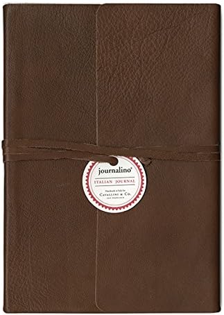 A brown textured leather journal with a matching elastic band closure and a round white paper label that reads: journalino' 
ITALIAN JOURNAL,
 made in Italy for 
Cavallini and Co.
 San Francisco