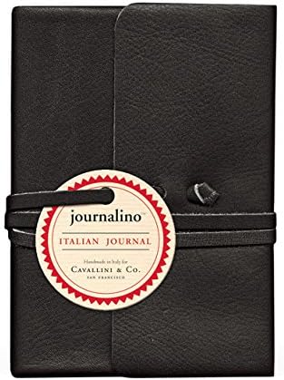 Black leather journal with a round white label on a dark background that reads:
 journalino™
ITALIAN JOURNAL 
Handmade in italy for 
Cavallini &amp; Co.
San Francisco 