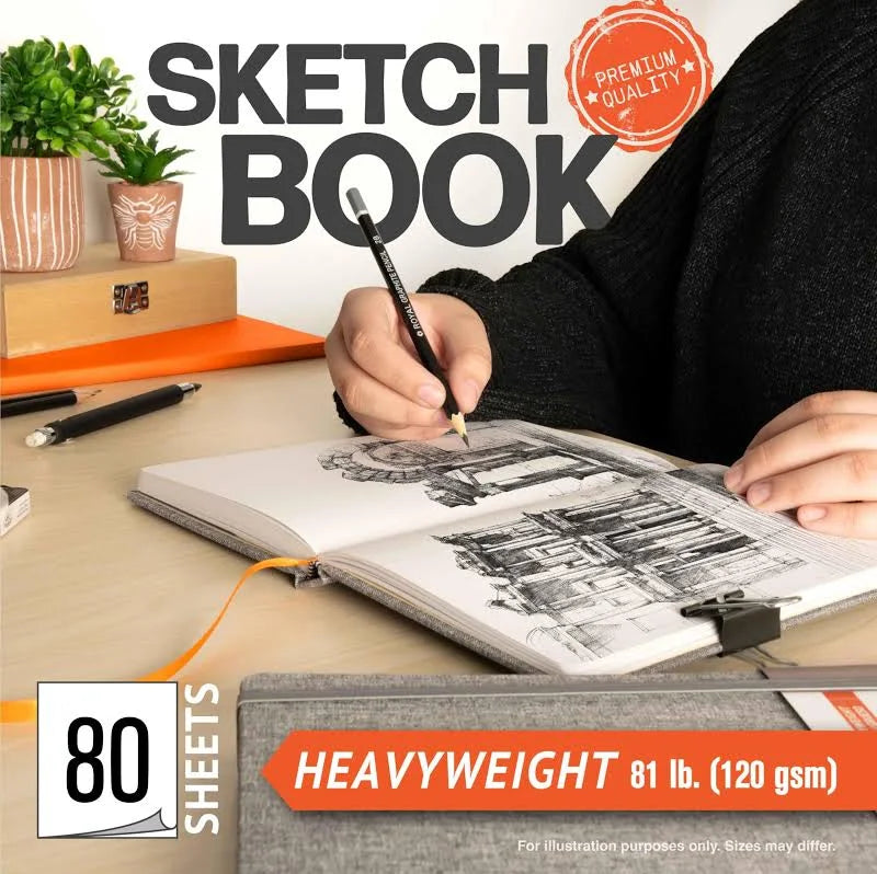 Person drawing in a sketchbook with a pen, surrounded by potted plants and stationery items.