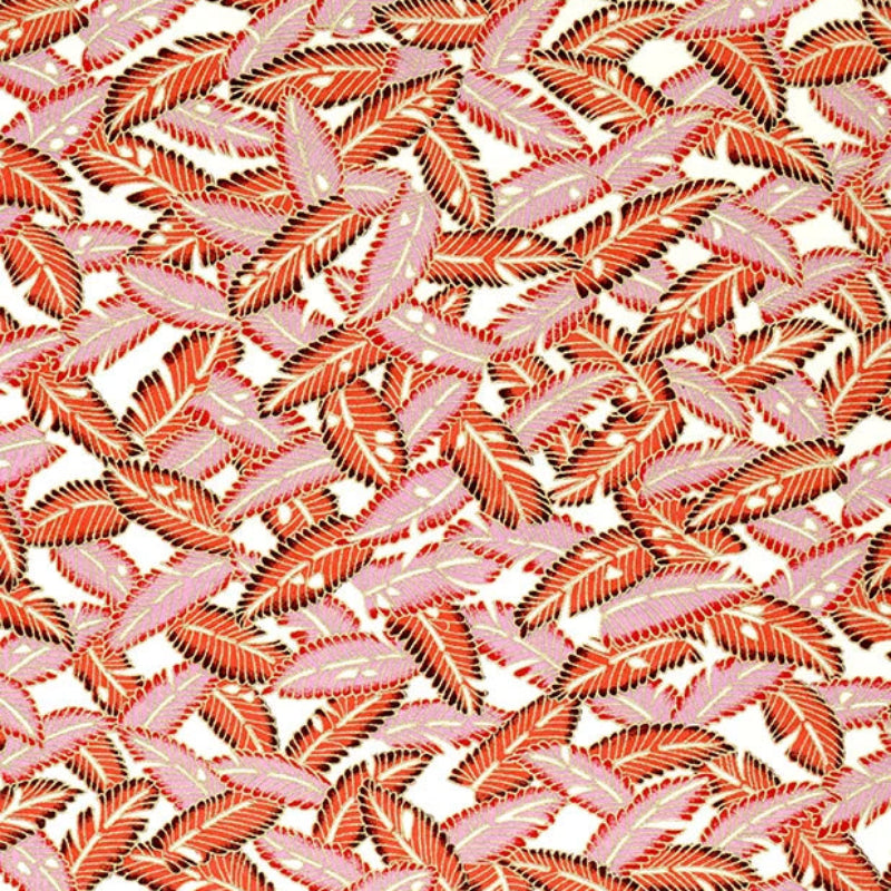 Patterned paper with red and coral leaves on a neutral background