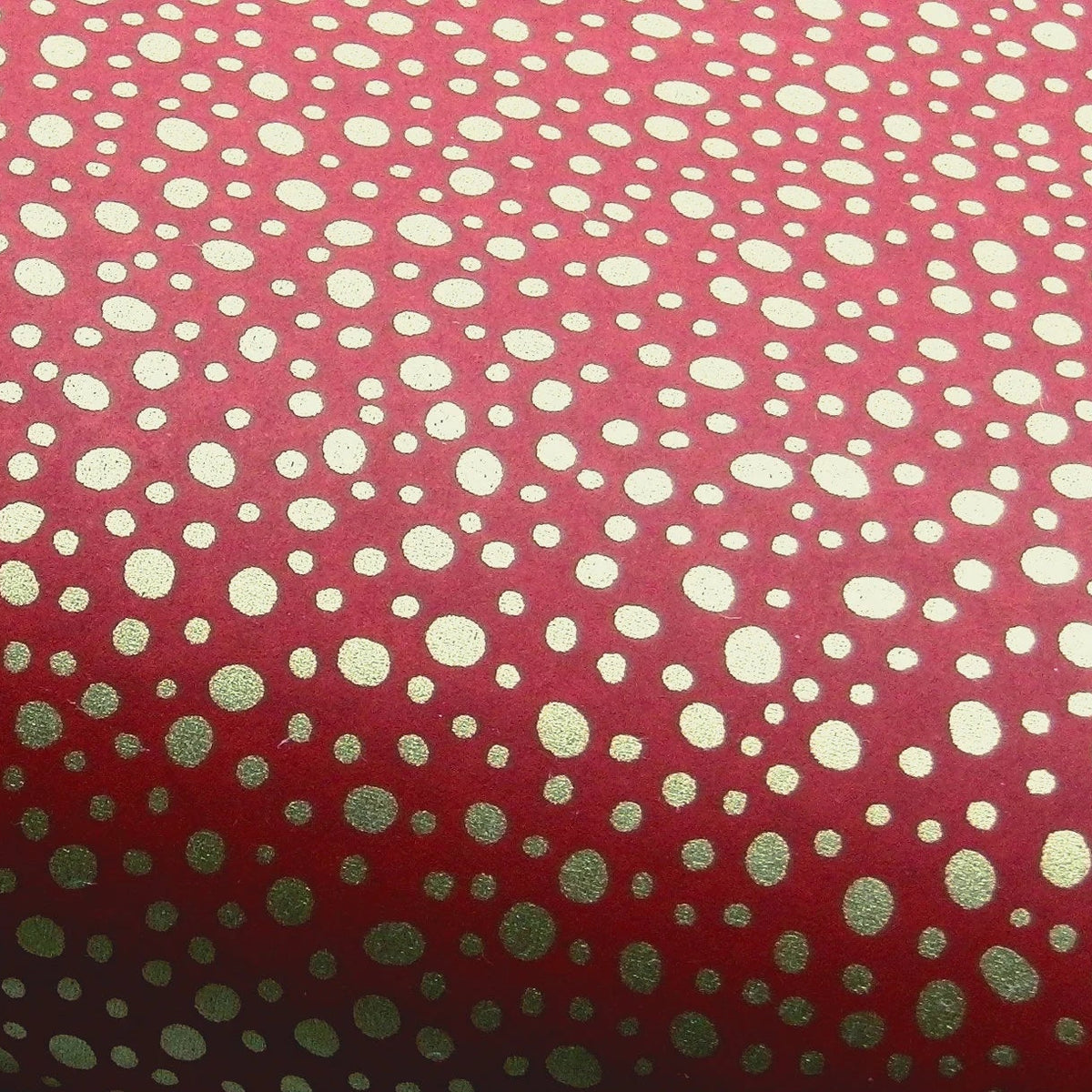 Red paper with gold dot pattern