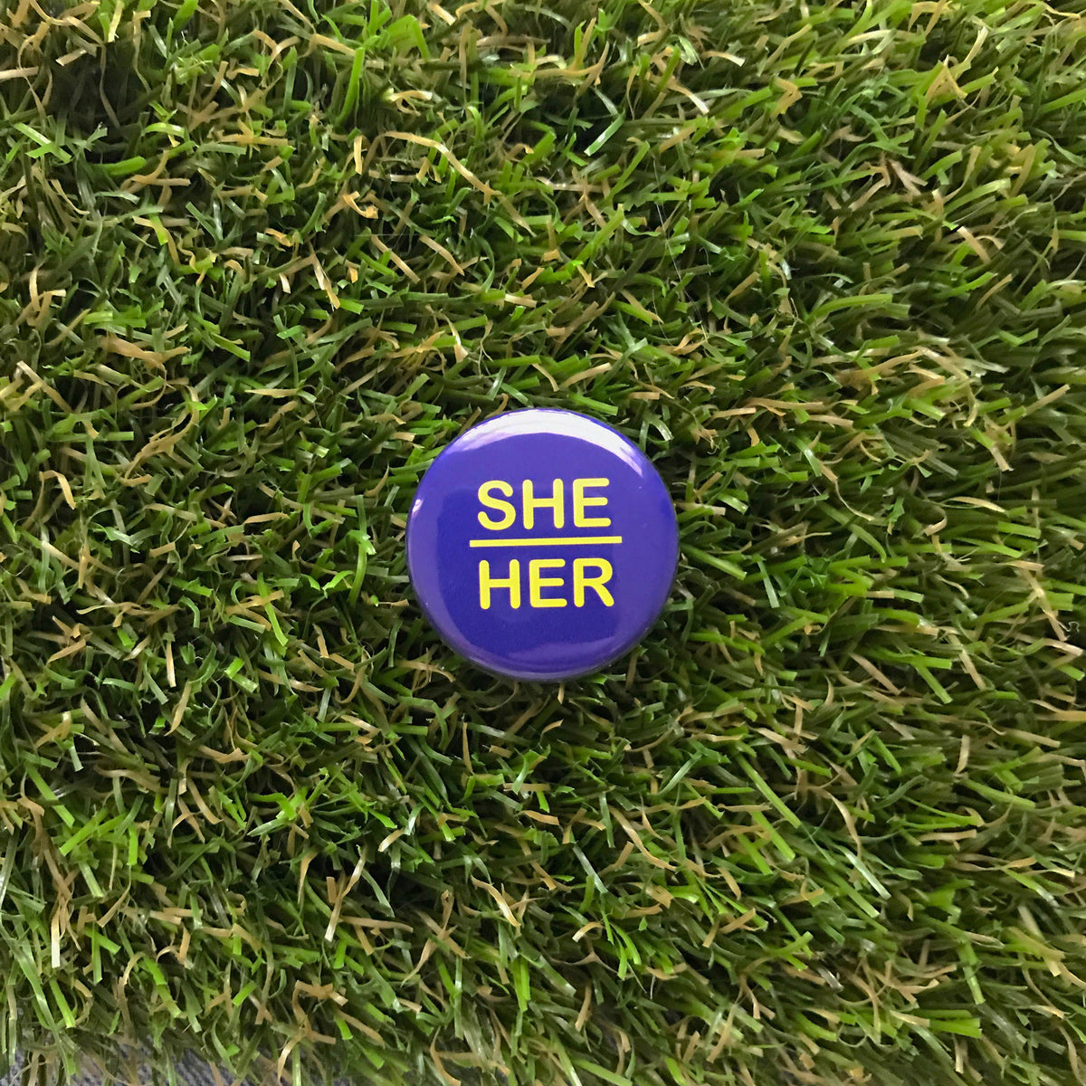 DDD BUTTON PIN - SHE/HER, PURPLE